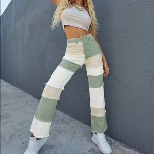 Green, cream, and white patch pants